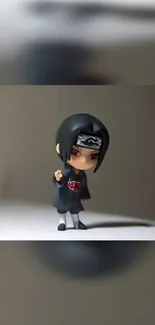 Chibi anime ninja figure on sleek background.