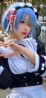 Anime cosplay with heart hand pose and blue hair.