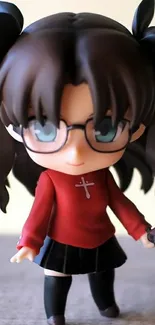 Cute anime figure with glasses in red outfit on mobile wallpaper.