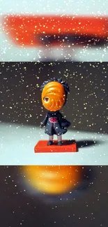 Anime figure with orange mask and snow effect wallpaper.