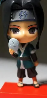 Anime figure holding a small stone, vibrant and colorful.