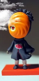 Anime figurine with orange mask on a minimalist background.