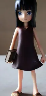 Anime figurine with black hair holding a book, standing on a beige surface.