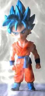 Anime figurine with blue hair and orange outfit on a neutral background.