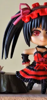 Anime figurine with cute red dress on wooden table.