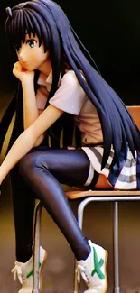 Anime figure of a girl sitting on a chair.