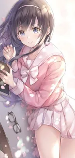 Anime girl in pink with sakura petals, holding a book.