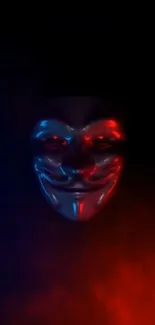 Anonymous mask with red and blue neon on a dark background.