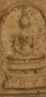 A beige stone relief with a Buddha design for mobile wallpaper.