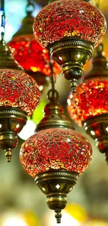 Antique red lanterns glowing with intricate design and warm light.