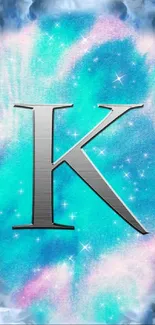 Aqua galaxy wallpaper with metal letter K and stars.