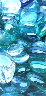 Vibrant aqua glass stones, reflecting elegant blue shades, ideal for phone wallpaper.