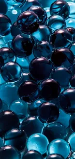 Mobile wallpaper featuring glossy aqua spheres with vibrant blue tones.