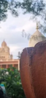 A scenic view of historical architecture with trees in the background.