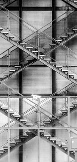 Black and white image of a modern steel staircase with geometric patterns.