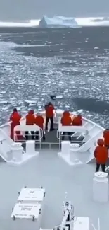 Ship navigating icy Arctic waters with an iceberg in view.