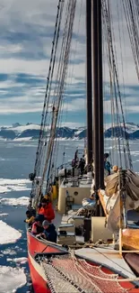 Historic ship sailing through Arctic icebergs in a stunning landscape view.