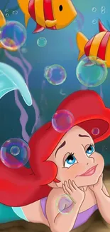 Ariel surrounded by fish and bubbles in an underwater scene.