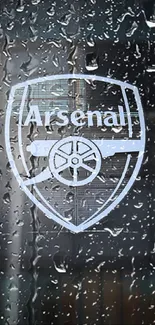 Arsenal crest on a dark, urban background mobile wallpaper.