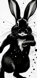 Artistic black rabbit with ink splashes on a mobile wallpaper.