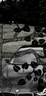 Artistic car with black tree branches overlay.