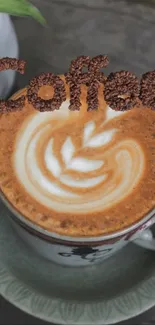 A cup of coffee with artistic latte art on a saucer.