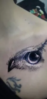 Artistic eye tattoo on shoulder with intricate design details.