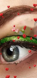 Close-up eye with green eyeliner and red hearts.