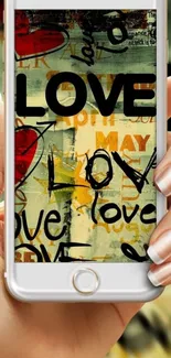 Artistic love-themed graffiti on mobile wallpaper.