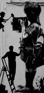 Silhouetted street art mural with playful figures.