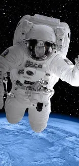 Astronaut floating in space above Earth with a starry background.