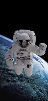 Astronaut floating in outer space with Earth in the background.