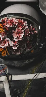 Astronaut with flowers and butterflies in helmet against a starry background.