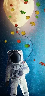 Astronaut with moon-shaped balloon amidst colorful leaves.