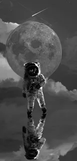 Astronaut reflecting on water with moon and clouds in monochrome design.