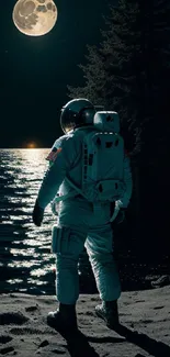 Astronaut standing on moonlit beach at night.