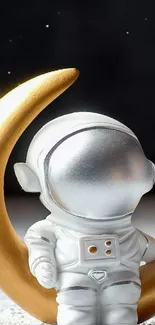 Cute astronaut toy with a golden crescent moon.