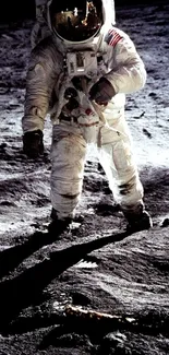 Astronaut walking on the moon's surface in space-themed mobile wallpaper.