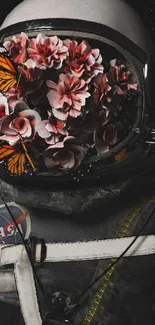 Astronaut helmet adorned with vibrant flowers and butterflies on a black background.