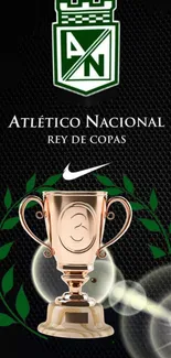 Atlético Nacional trophy with green leaves and golden cup on black background.