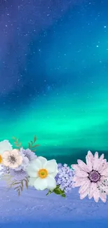 Aurora Borealis with floral overlay on snowy landscape wallpaper.