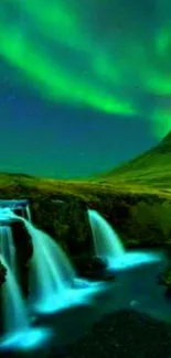 Green aurora borealis over waterfall landscape.