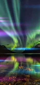 Northern lights over a lake and mountains with vibrant reflections.