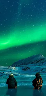 Aurora borealis over icy landscape with green lights in the Arctic night sky.