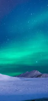 Aurora borealis illuminating snowy mountains under a starry night sky.