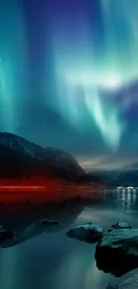 Aurora Borealis over calm night landscape with mountains and water.