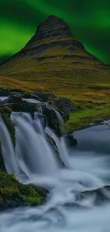 Northern Lights over a waterfall landscape.