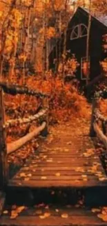 Rustic bridge leading to cabin in vibrant autumn forest.