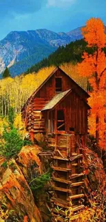 Vibrant autumn mountain cabin wallpaper with colorful foliage.