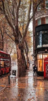 Autumn city street with red bus and phone booth.